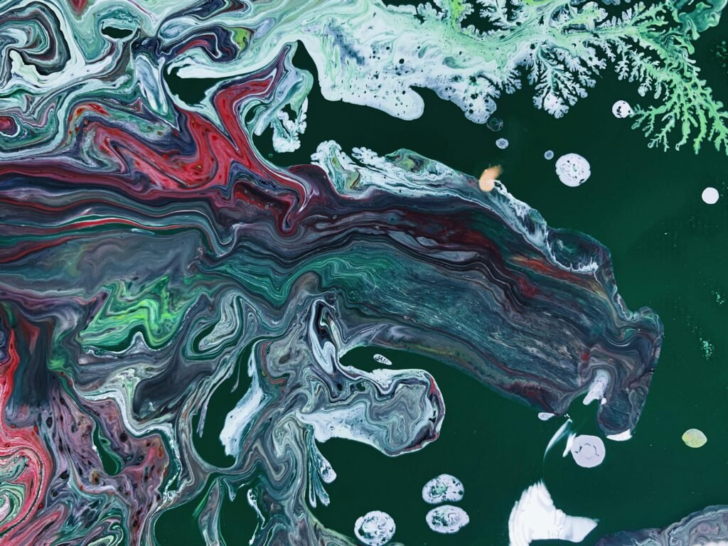 Vivid and vibrant abstract acrylic paint swirl with rich colors and dynamic patterns, perfect for artistic backgrounds.